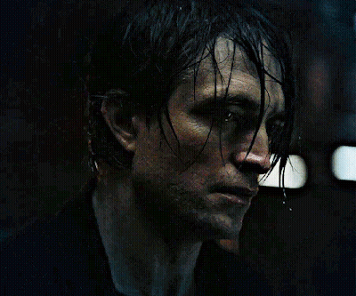 A Close Up Of A Man 'S Face With Wet Hair On It GIF