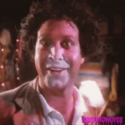 A Close Up Of A Man 'S Face With White Paint On It . GIF