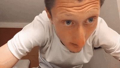A Close Up Of A Man 'S Face With Wrinkles And Blue Eyes GIF