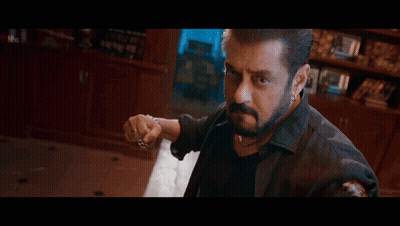A Close Up Of A Man 'S Fist Holding A Chain . GIF