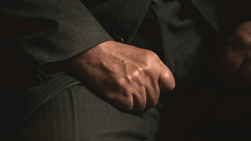 A Close Up Of A Man 'S Hand With A Ring On It GIF