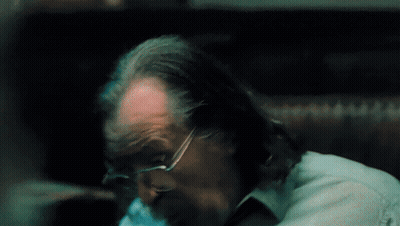 A Close Up Of A Man 'S Head With Glasses And A Beard GIF