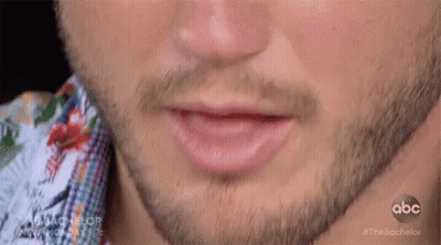 A Close Up Of A Man 'S Mouth With A Beard GIF