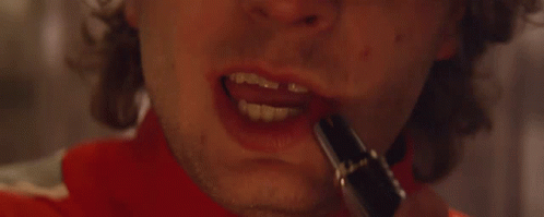 A Close Up Of A Man 'S Mouth With Red Lipstick On It . GIF