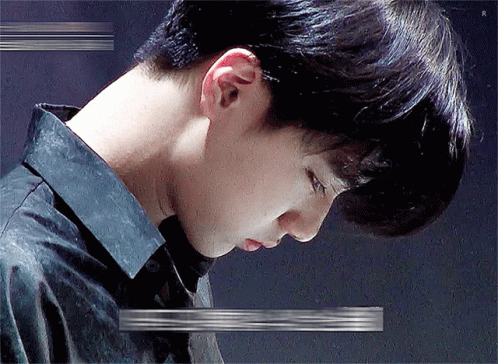 A Close Up Of A Man 'S Neck And Ear With A Glitch Effect . GIF