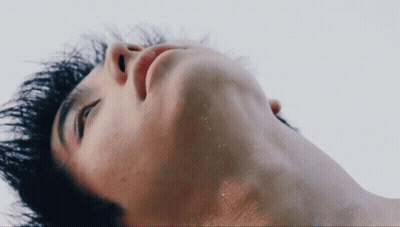 A Close Up Of A Man 'S Neck And Face GIF