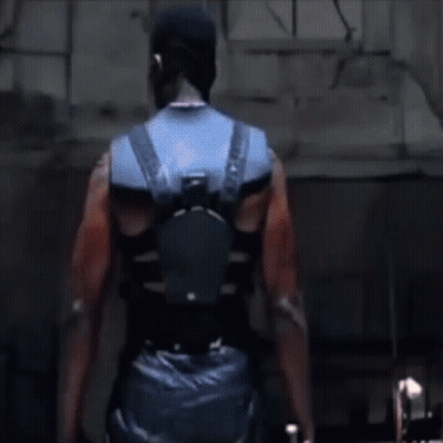 A Close Up Of A Man 'S Shoulder With A Tattoo On It GIF