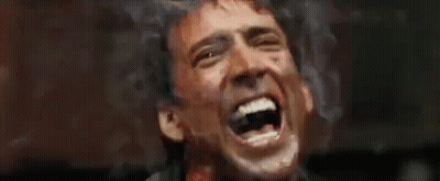 A Close Up Of A Man Screaming With Blood On His Face . GIF