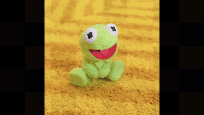 A Close Up Of A Man Singing Into A Microphone . GIF