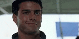 A Close Up Of A Man Smiling With His Mouth Open . GIF
