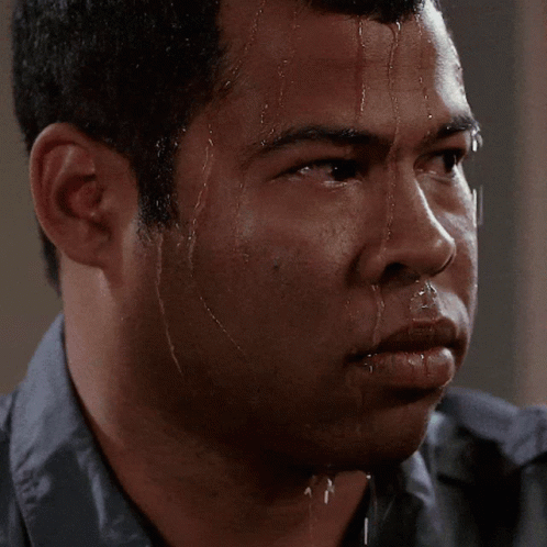 A Close Up Of A Man Sweating With Water Running Down His Face GIF