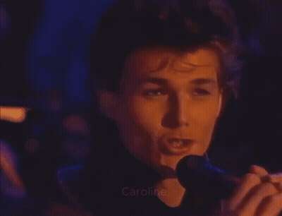 A Close Up Of A Man Taking A Picture With The Name Caroline Visible GIF