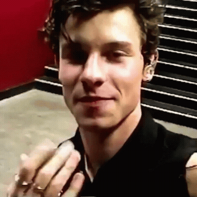 A Close Up Of A Man Taking A Selfie With His Hands In Front Of Stairs . GIF