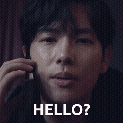 A Close Up Of A Man Talking On A Cell Phone With The Words Hello Written On The Bottom GIF