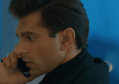 A Close Up Of A Man Talking On A Cellphone GIF