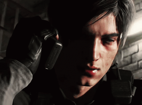 A Close Up Of A Man Talking On A Walkie Talkie With The Word Warning On It GIF
