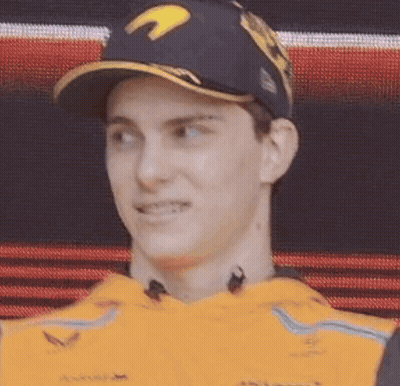 A Close Up Of A Man Wearing A Baseball Cap And A Yellow Shirt . GIF