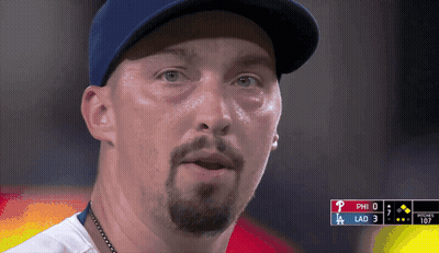 A Close Up Of A Man Wearing A Baseball Cap With The Letters Phi And Lad Visible GIF
