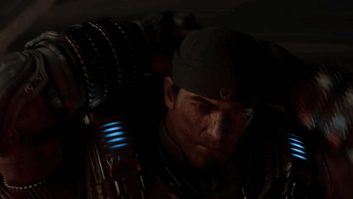 A Close Up Of A Man Wearing A Black Headband With A W On It GIF