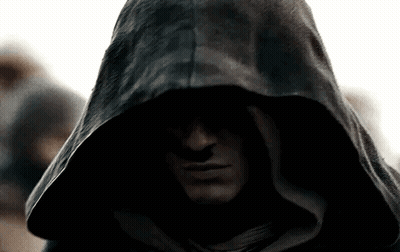 A Close Up Of A Man Wearing A Black Hood GIF