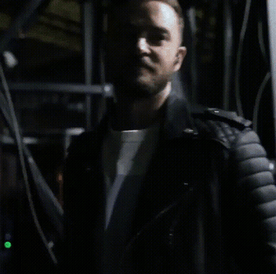 A Close Up Of A Man Wearing A Black Leather Jacket GIF