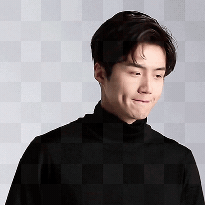 A Close Up Of A Man Wearing A Black Turtleneck GIF