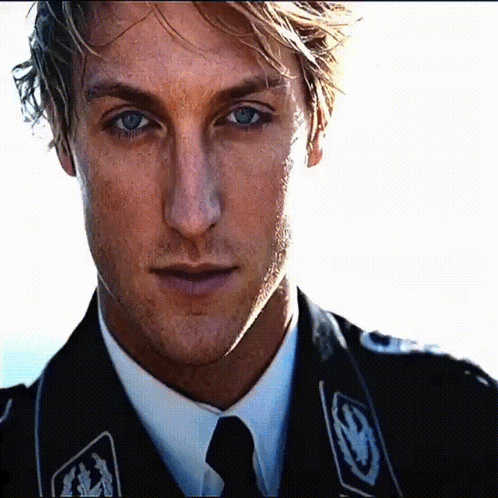 A Close Up Of A Man Wearing A Black Uniform GIF