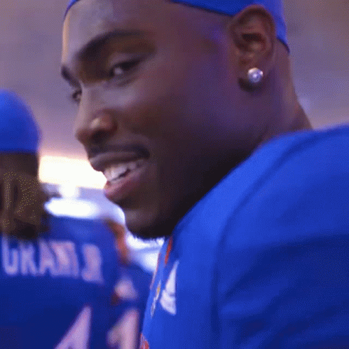 A Close Up Of A Man Wearing A Blue Adidas Shirt GIF