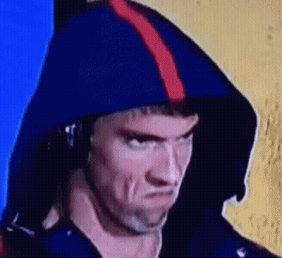 A Close Up Of A Man Wearing A Blue Hoodie And Headphones . GIF