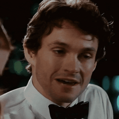 A Close Up Of A Man Wearing A Bow Tie And A White Shirt GIF