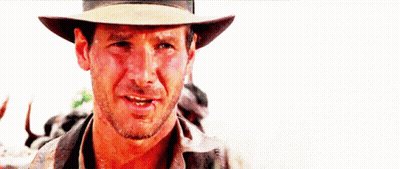 A Close Up Of A Man Wearing A Cowboy Hat And Smiling GIF