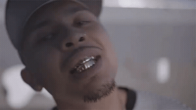 A Close Up Of A Man Wearing A Hat And A Beard With His Mouth Open . GIF