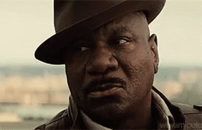 A Close Up Of A Man Wearing A Hat And A Jacket . GIF