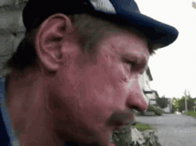 A Close Up Of A Man Wearing A Hat And A Mustache GIF