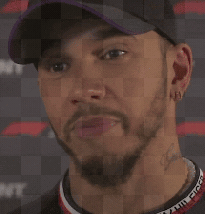 A Close Up Of A Man Wearing A Hat And Earrings Saying `` I 'M Definitely Not Fast '' . GIF
