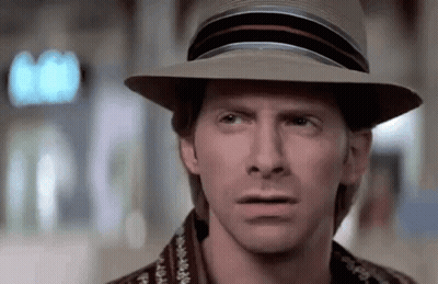 A Close Up Of A Man Wearing A Hat Making A Funny Face . GIF