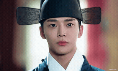 A Close Up Of A Man Wearing A Hat With The Word Dorothy On The Bottom Right GIF