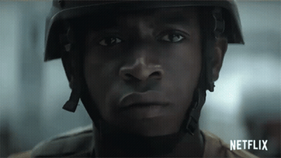 A Close Up Of A Man Wearing A Helmet And A Netflix Logo GIF