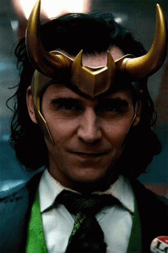 A Close Up Of A Man Wearing A Helmet And A Tie GIF