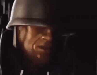 A Close Up Of A Man Wearing A Helmet And Headphones . GIF