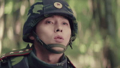 A Close Up Of A Man Wearing A Helmet With A Star On It GIF