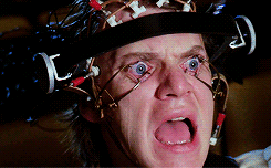 A Close Up Of A Man Wearing A Helmet With Wires Attached To It GIF