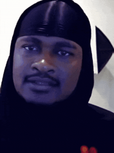 A Close Up Of A Man Wearing A Hood GIF