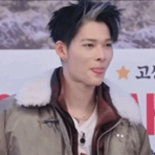 A Close Up Of A Man Wearing A Jacket And A White Collar . GIF
