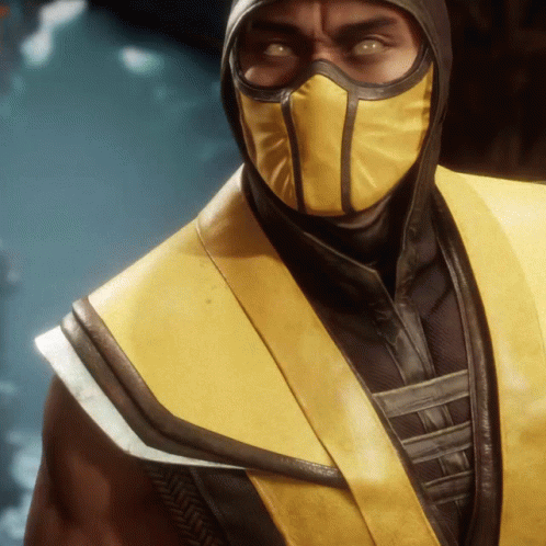 A Close Up Of A Man Wearing A Mask And A Yellow Jacket GIF