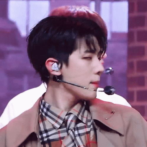 A Close Up Of A Man Wearing A Microphone And Earphones GIF