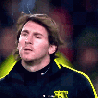 A Close Up Of A Man Wearing A Nike Jacket With A Fc Barcelona Logo On It GIF
