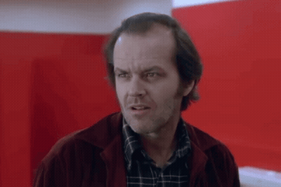 A Close Up Of A Man Wearing A Plaid Shirt And A Red Jacket . GIF