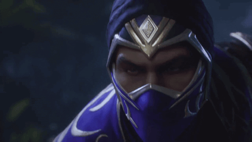A Close Up Of A Man Wearing A Purple Mask And Helmet GIF
