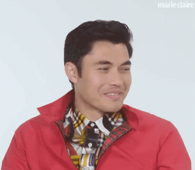 A Close Up Of A Man Wearing A Red Jacket And A Plaid Shirt . GIF